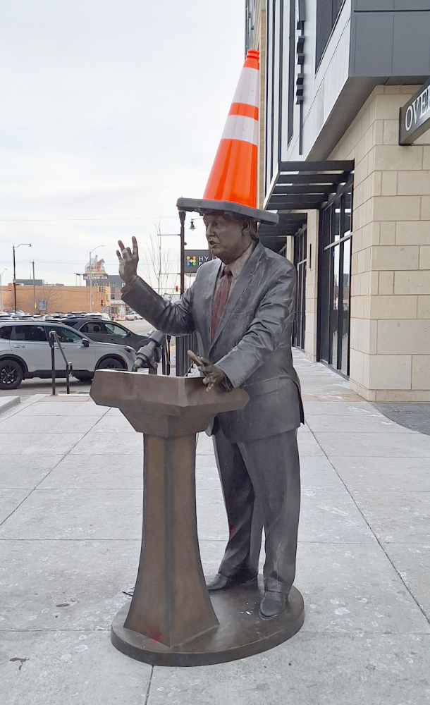 Trump statue with traffic cone